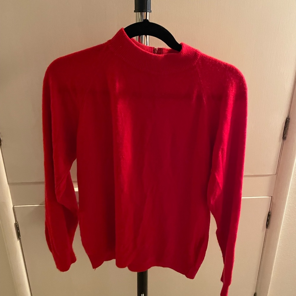 Light red sweater with zipper in back